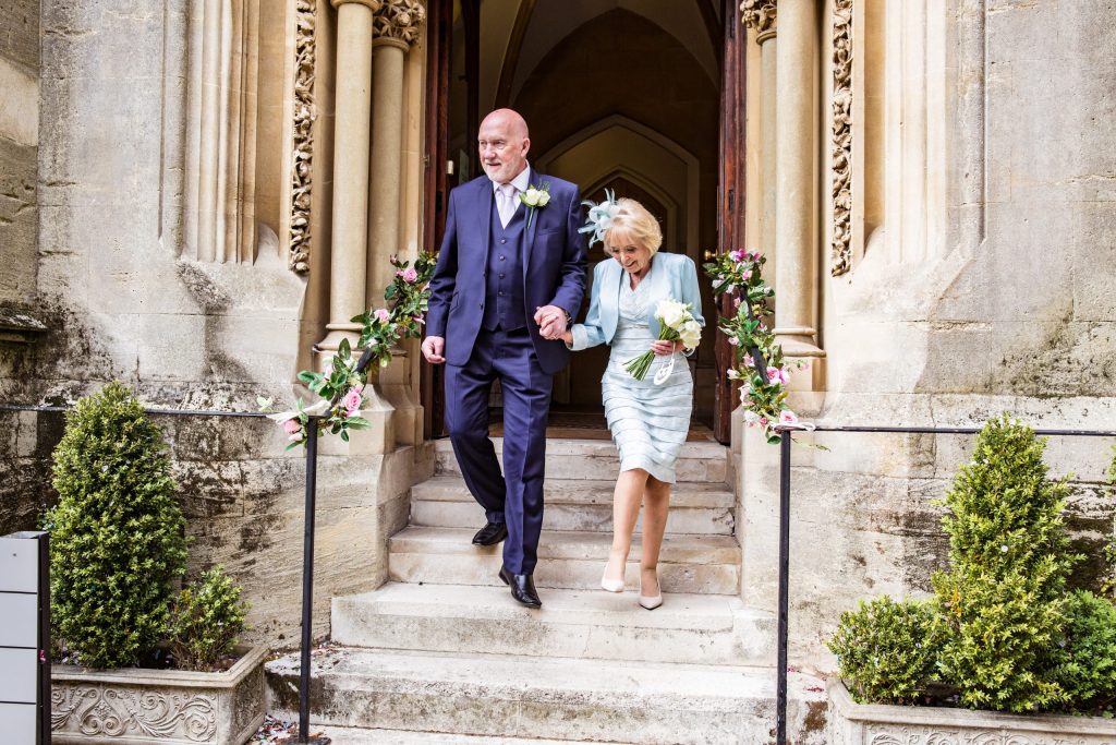 Bride and Groom skip down steps, Cheshunt registry office photographer