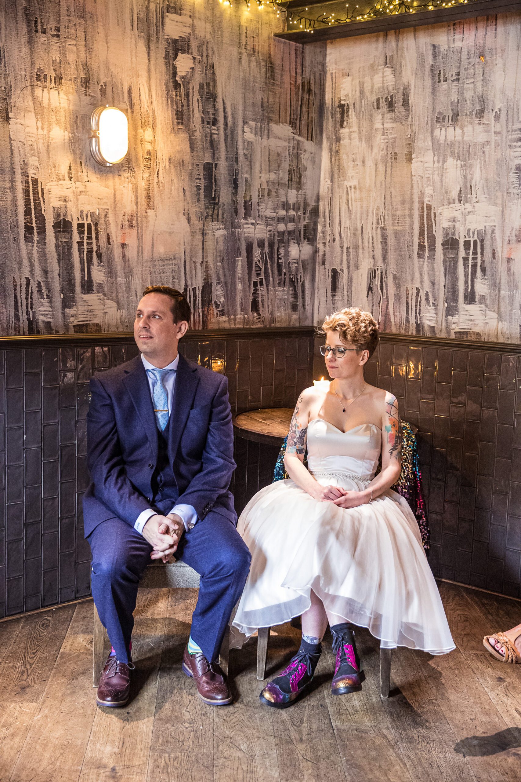 The bride and groom are seated as their ceremony begins at Balfour St Barts in London