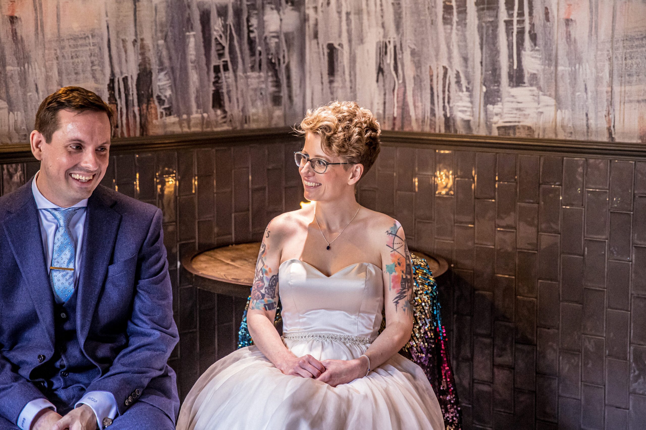 the bride smiles during her wedding ceremony at Balfour St Barts in london