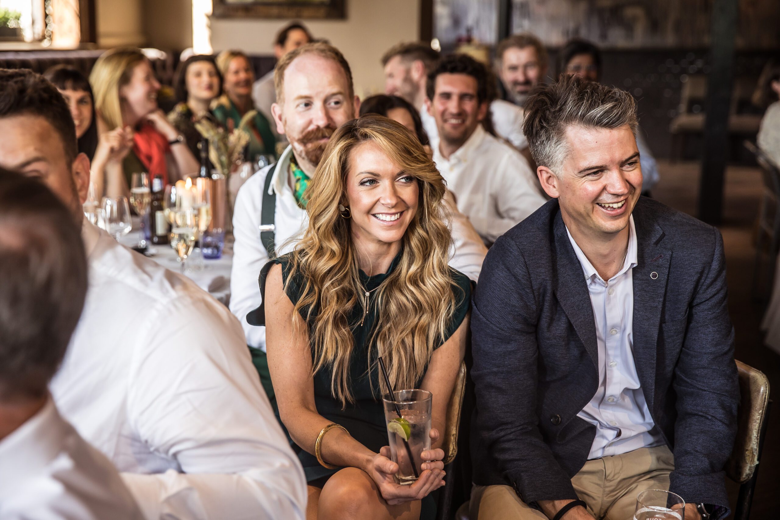 A guest smiles during speeches at balfour st barts wedding