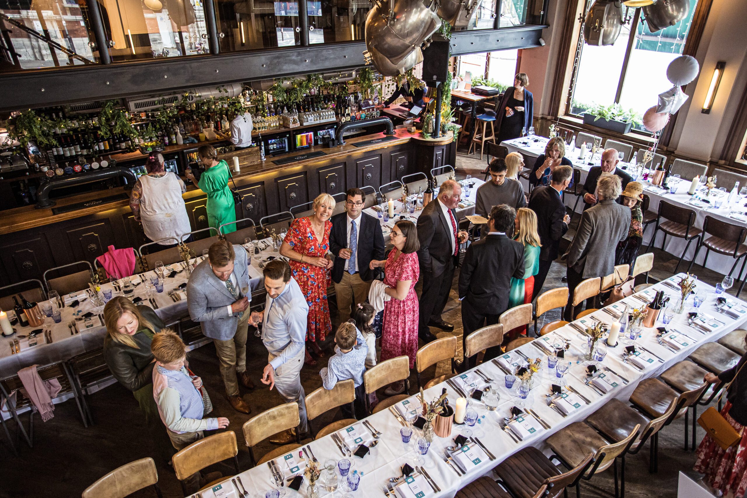 Guests have drinks at Balfour St parts pub wedding